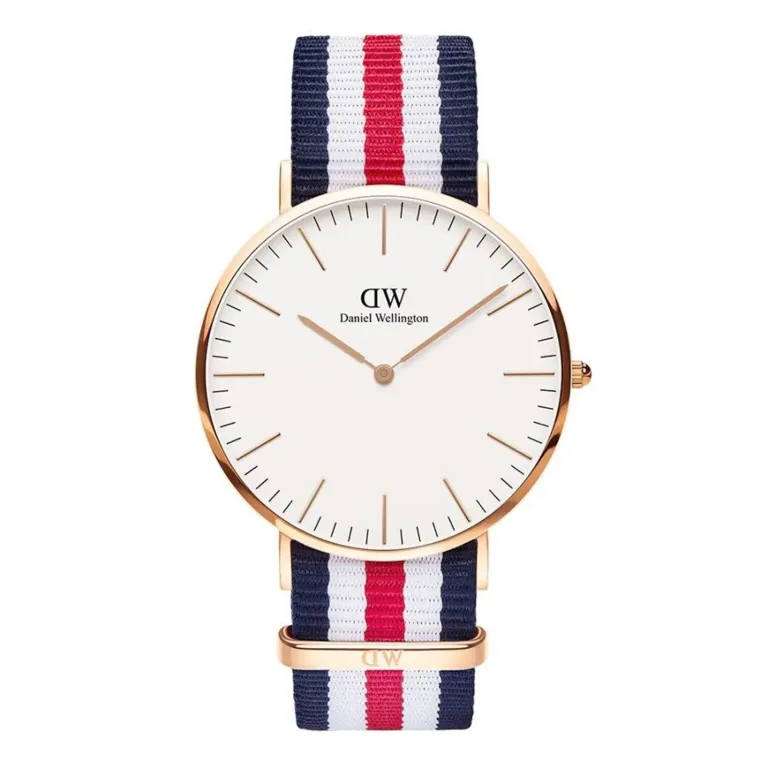 A stylish Daniel Wellington watch featuring a white face, gold hands, and a navy, red, and white striped fabric strap.